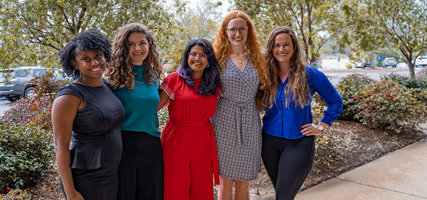 Clinical and Counseling Psychology Doctoral Students standing outside of the CEPS building on campus.